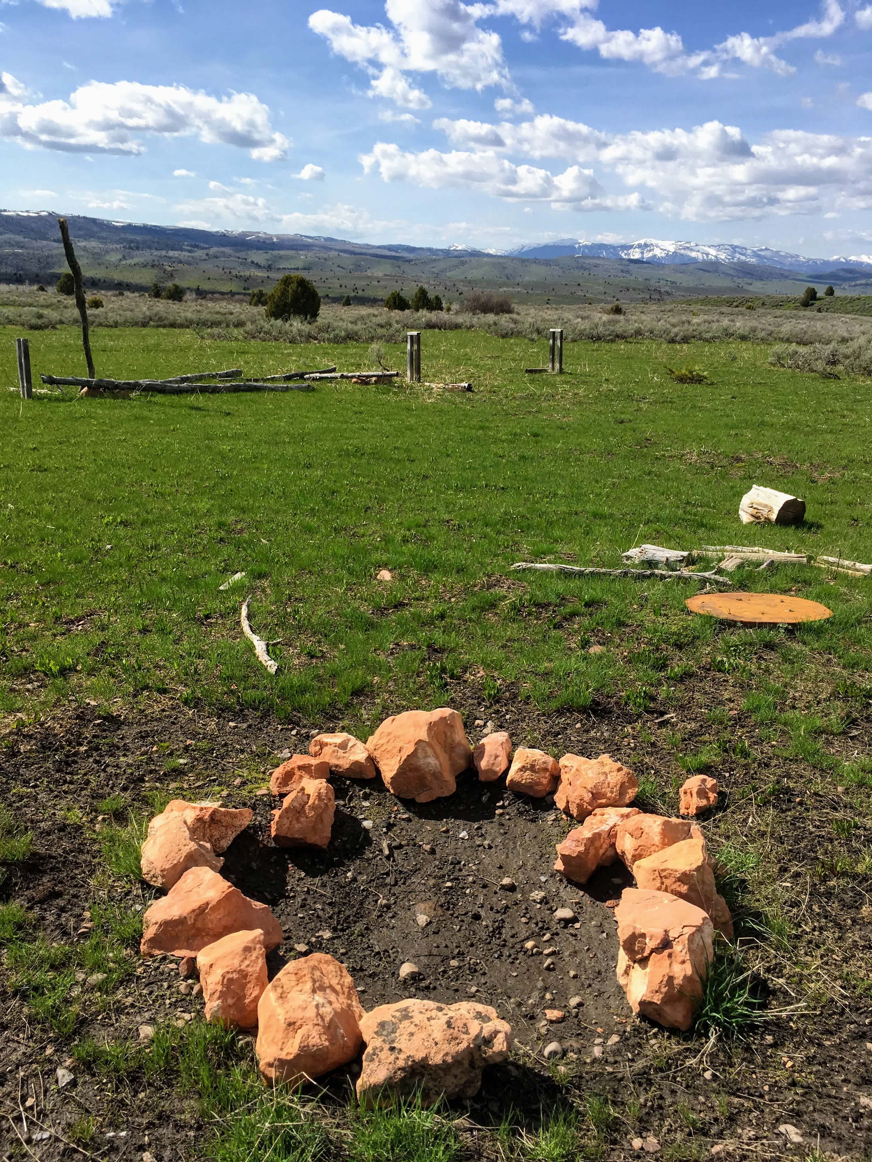 View looking west by the large fire pit area.  Plenty of wood logs for seats if you don't bring your own!
