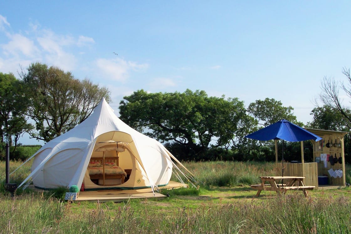 Each tent has its own private facilities, including outdoor kitchen, picnic table, fire-pit, toilet and shower room.
