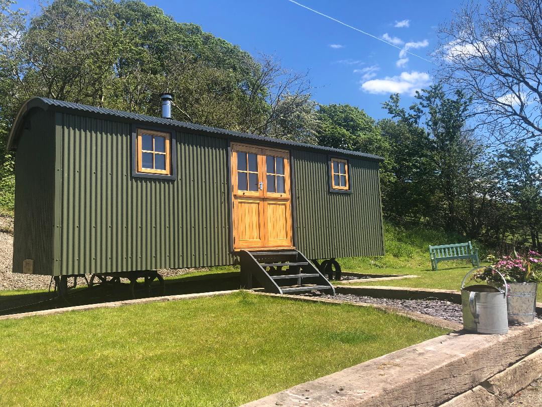 Brondel Glamping enjoys spectacular views over a Welsh valley.
