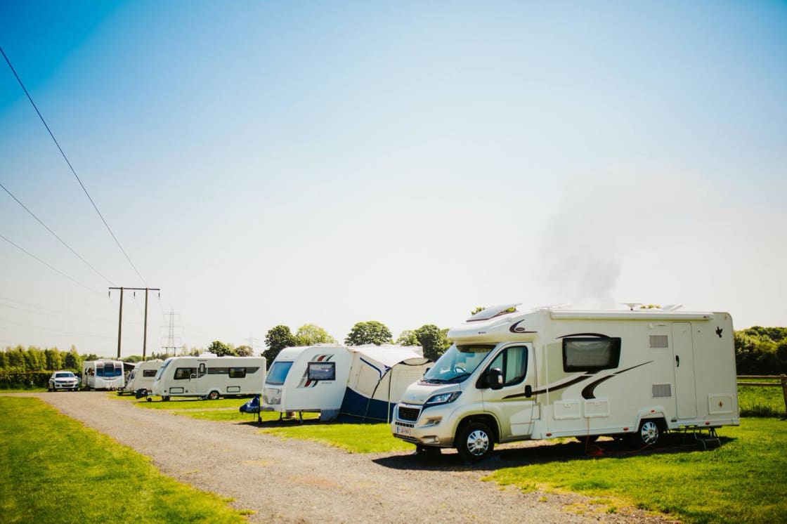 Caravans park up on the hardstanding pitches at Butt Farm Campsite, Beverley.