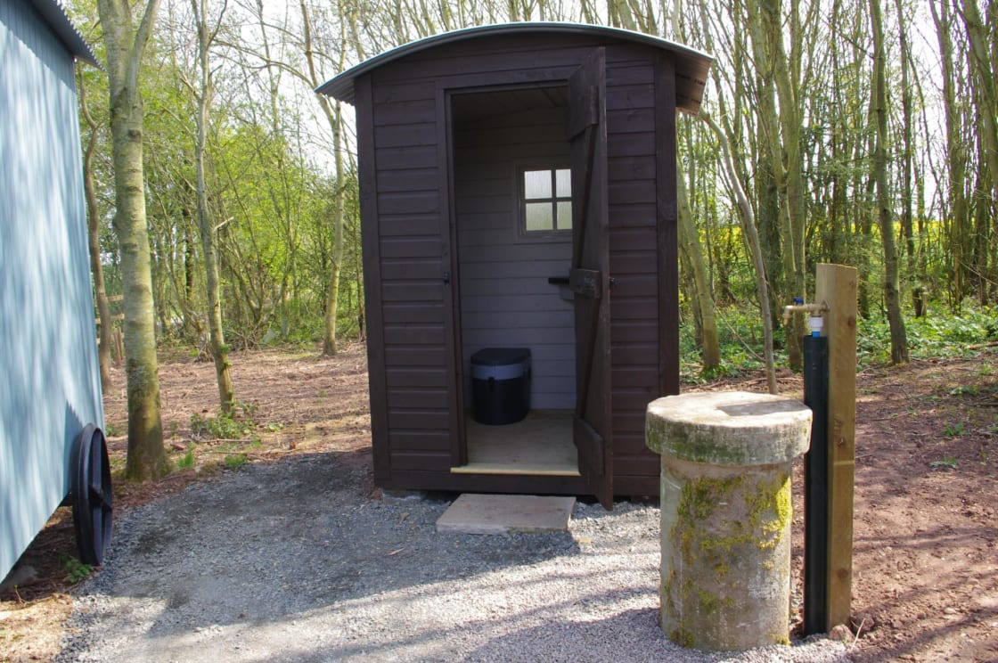 Shepherd's Hut at Broadmeadow Glamping. Composting toilet room and outdoor tap.