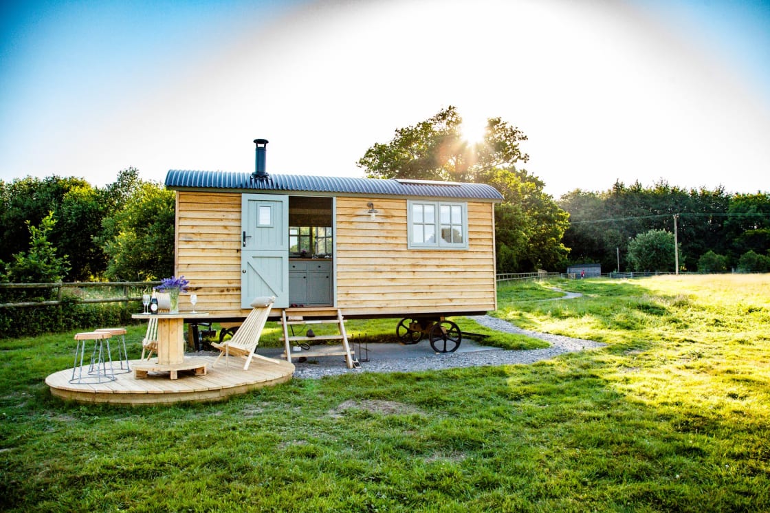 Like a luxury hotel room on wheels, this shepherds hut for two includes double bed, kitchen facilities, shower, and a Scandinavian wood-fired fresh water hot tub. 