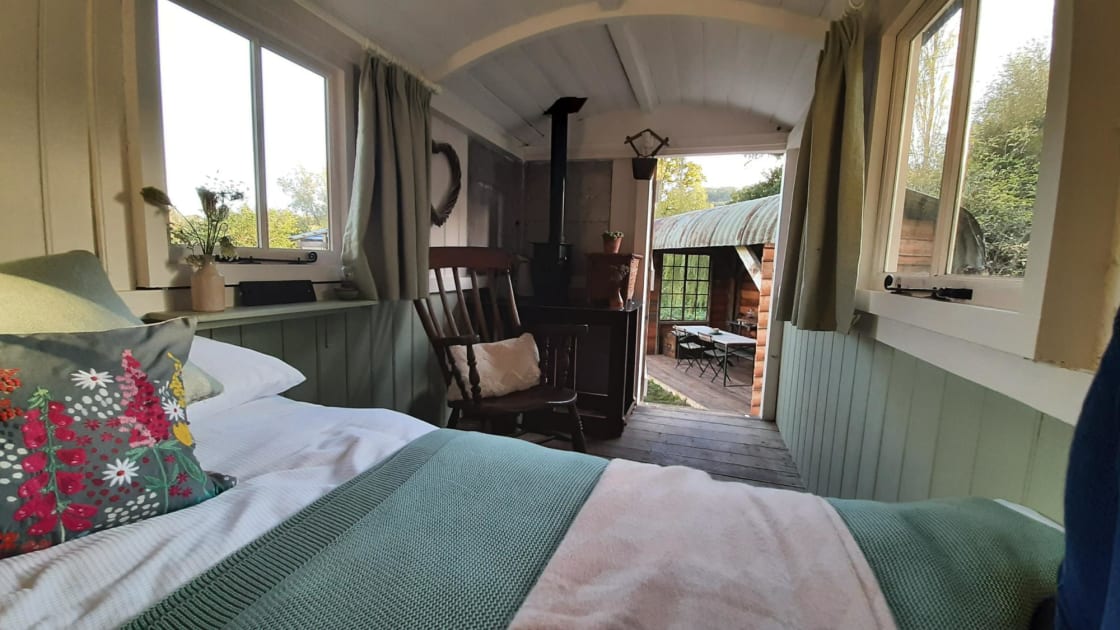 View from the double bed, with wood-burning stove in the corner