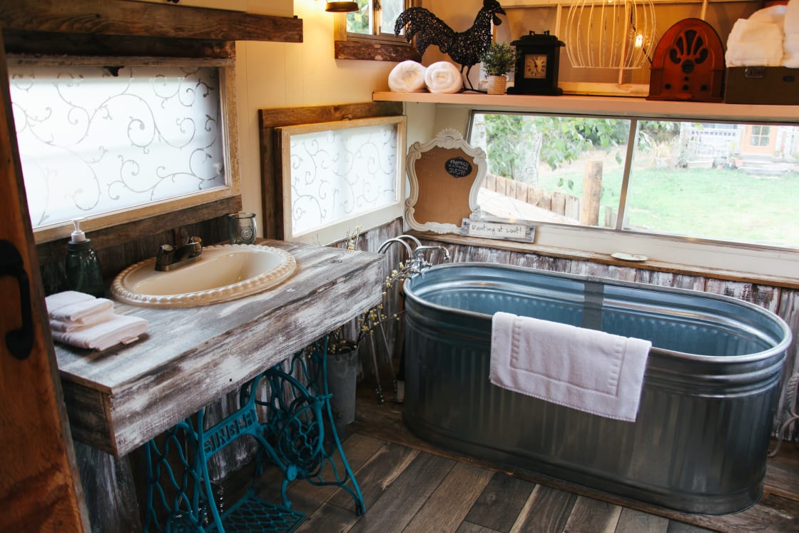 The trough bath and sink area takes this stay to the next level!