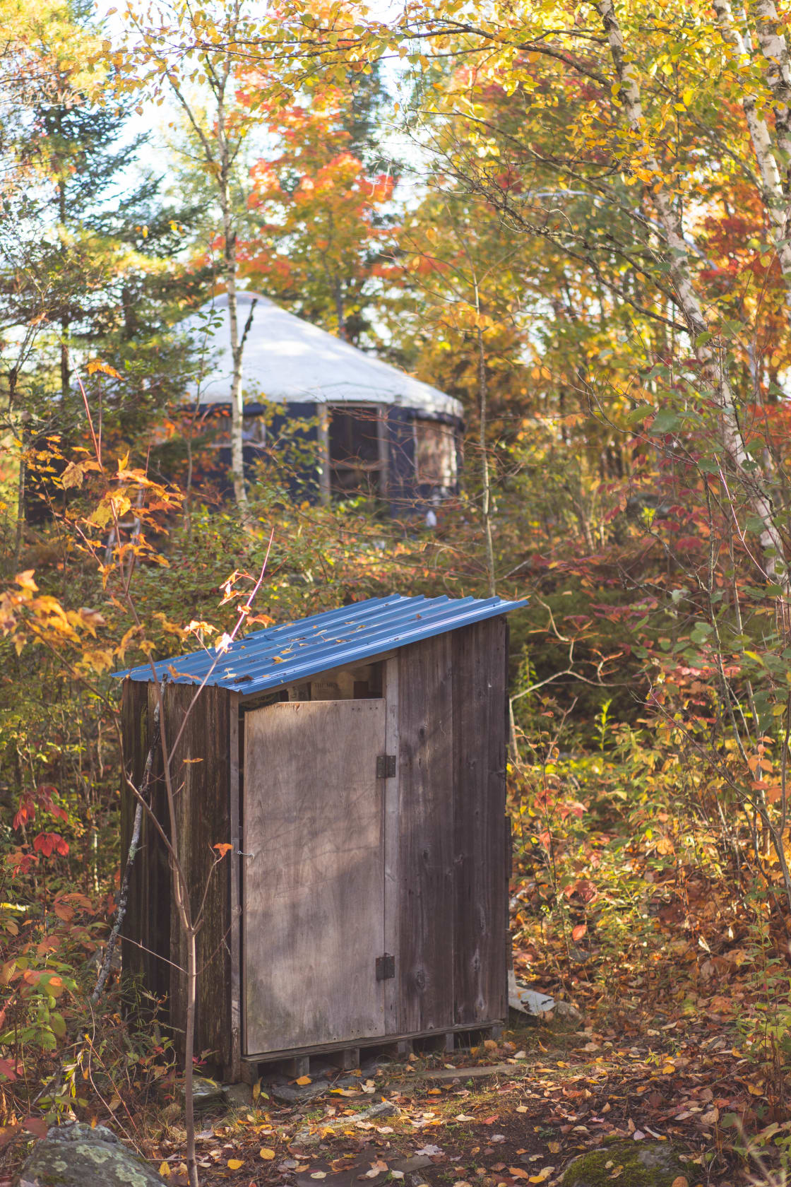 Outhouse with the wall tent in the background.