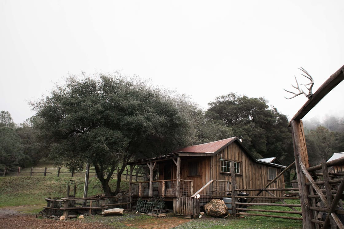 View of the cabin and corral from the barn