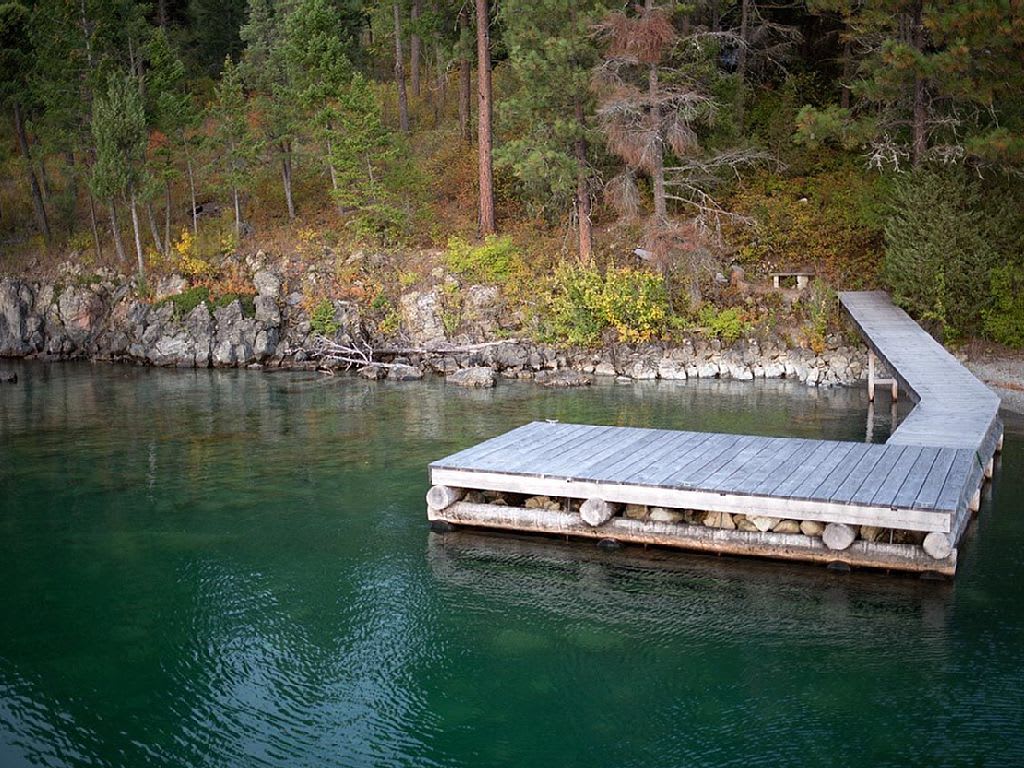 Large dock with alcove to park a boat. Rocky beach with great swimming hole off the dock