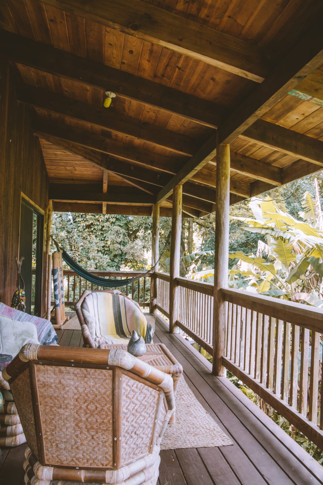The back porch with seating, an amazing view and a hammock for relaxing and reading a book. Such a pretty spot to hang out