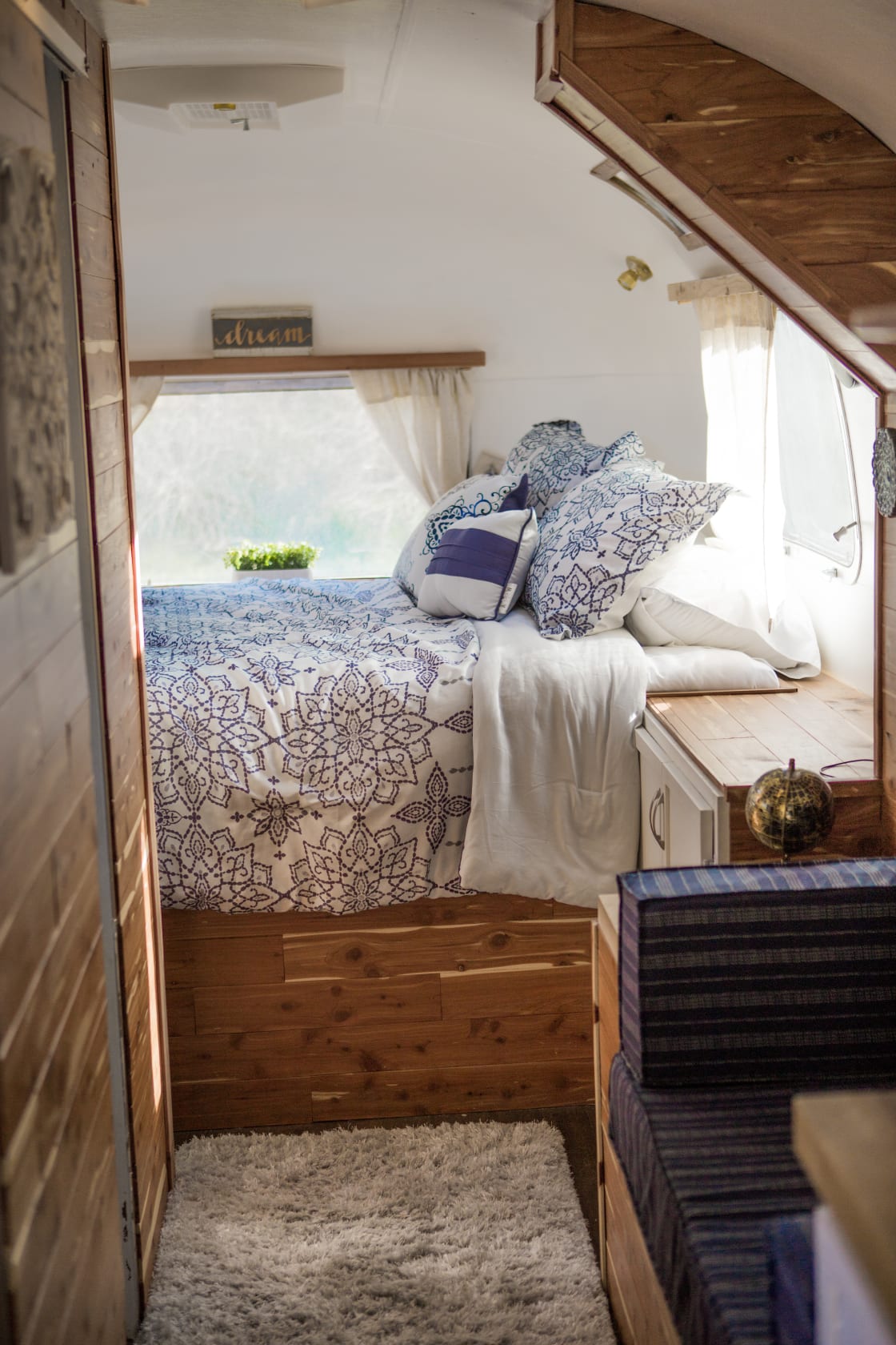 The bed in the back of the airstream, very cozy and cute!