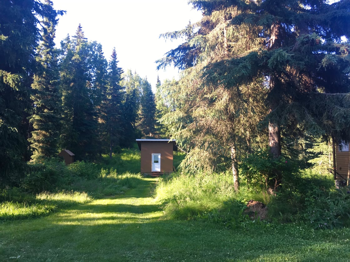 The cabin is located behind our home. 