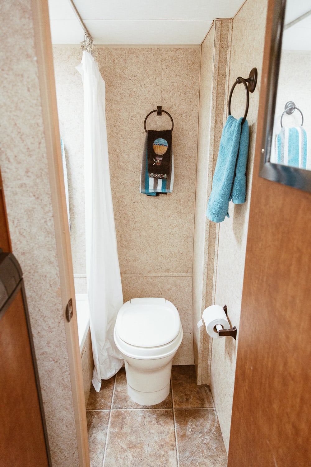 small bathroom with toilet, shower, and bath 