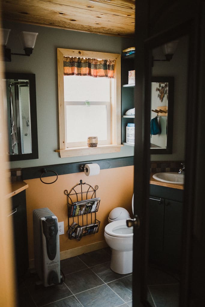 The cutest little bathroom with a running toilet & shower.