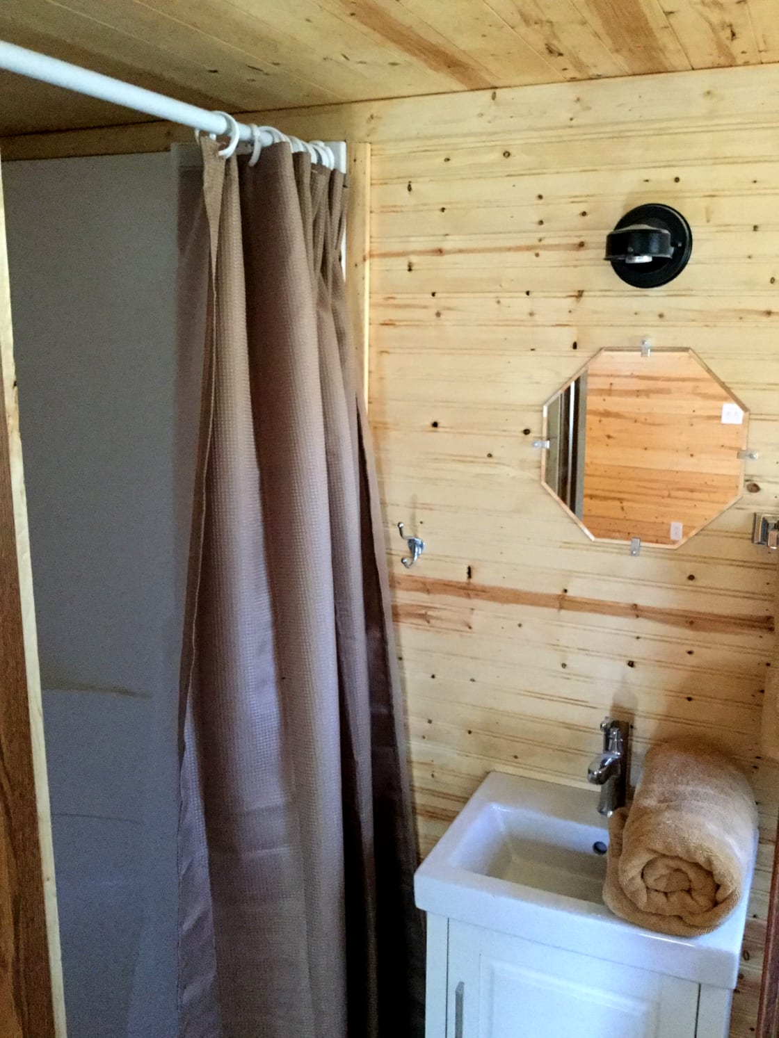 The bathroom includes a stand-up shower.