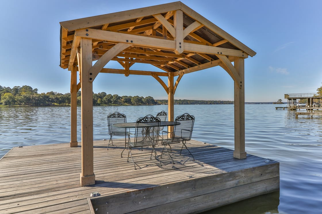 Just relax and lounge or fish from our covered boat dock