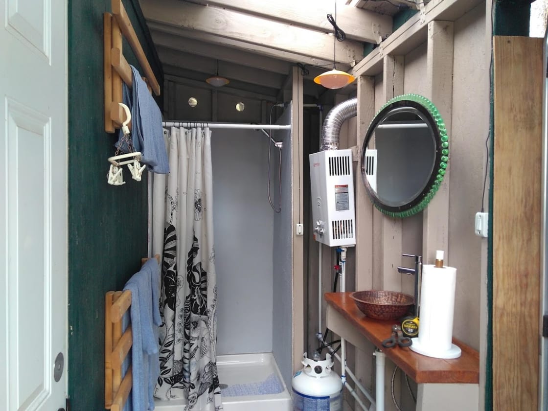 Propane hot water on demand shower with wash basin in your cabin
