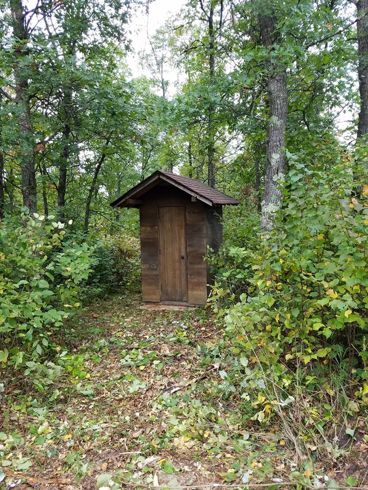 outhouse, den