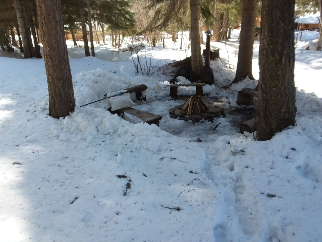 Fire circle, located next to the creek.  Grill hot dogs, make smores, or just enjoy the fire.