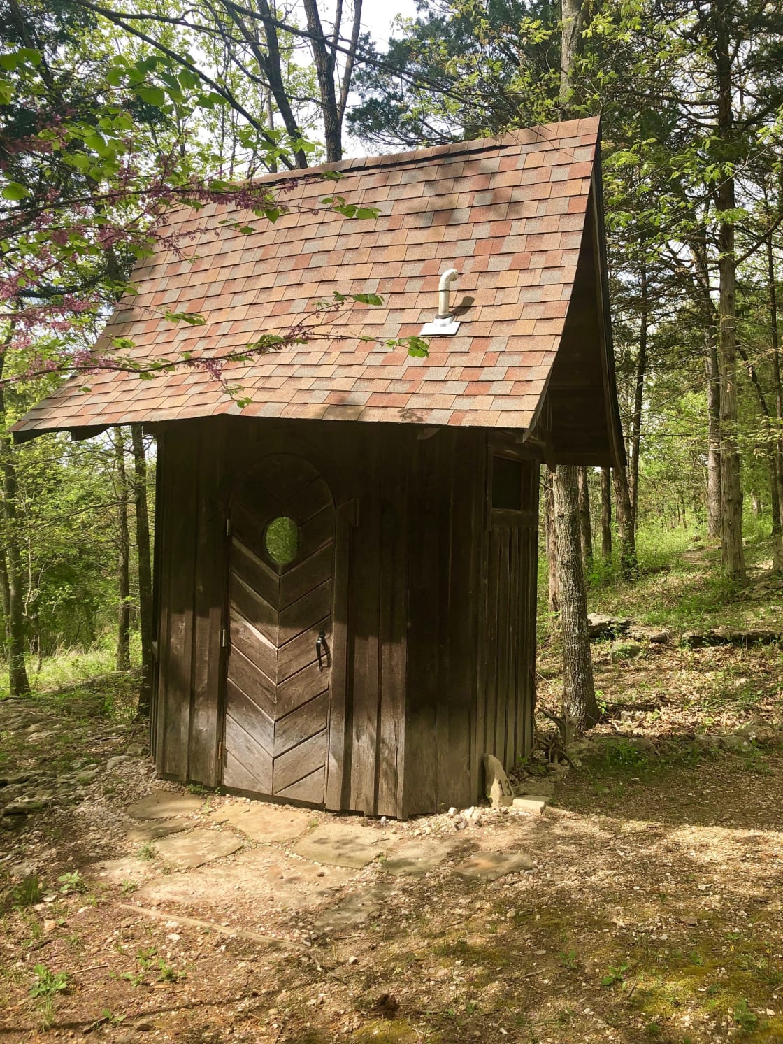 The composting toilet outhouse is spacious and well lit by windows overlooking the Sanctuary.  It never smells of anything other than cedar!