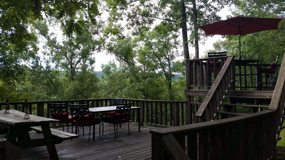 Eat, read, relax on the 3-tier deck overlooking the river. Some of our guests set their tent up on the deck to enjoy the view.