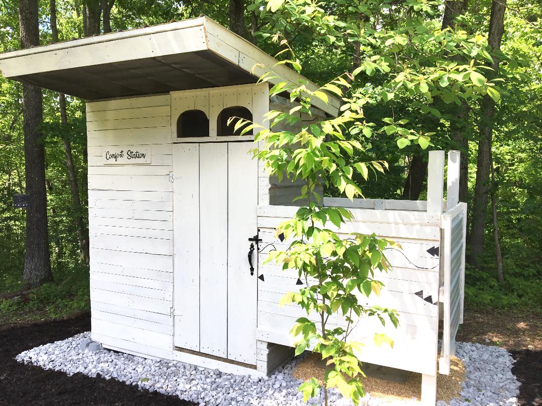 The comfort station where campers can use a portable camping toilet, shower with a solar shower bag, or change clothes after playing in the streams.