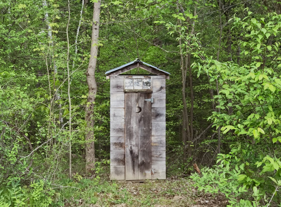 Outhouse with composting toilet is a five minute walk from your campsite.