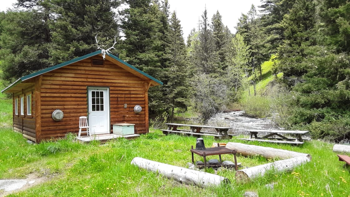 Rustic cabin on bank of North Fork of Bear Creek.  Private and secluded but can be accessed by vehicle.  