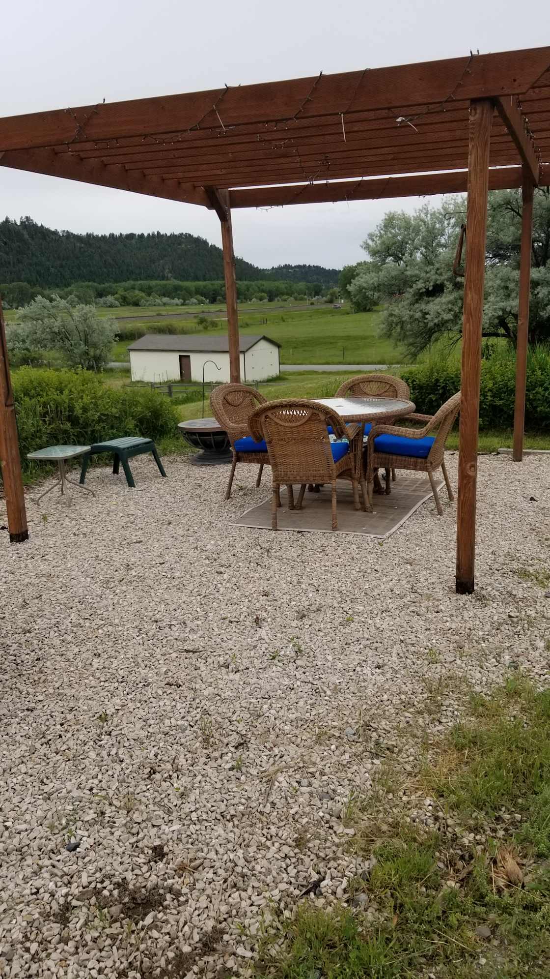 Pergula area with table and chairs available.