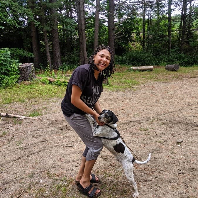 Maya with our dog, Winston, on the campsite