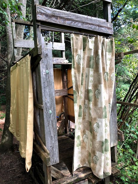 The rustic yet private outdoor shower
