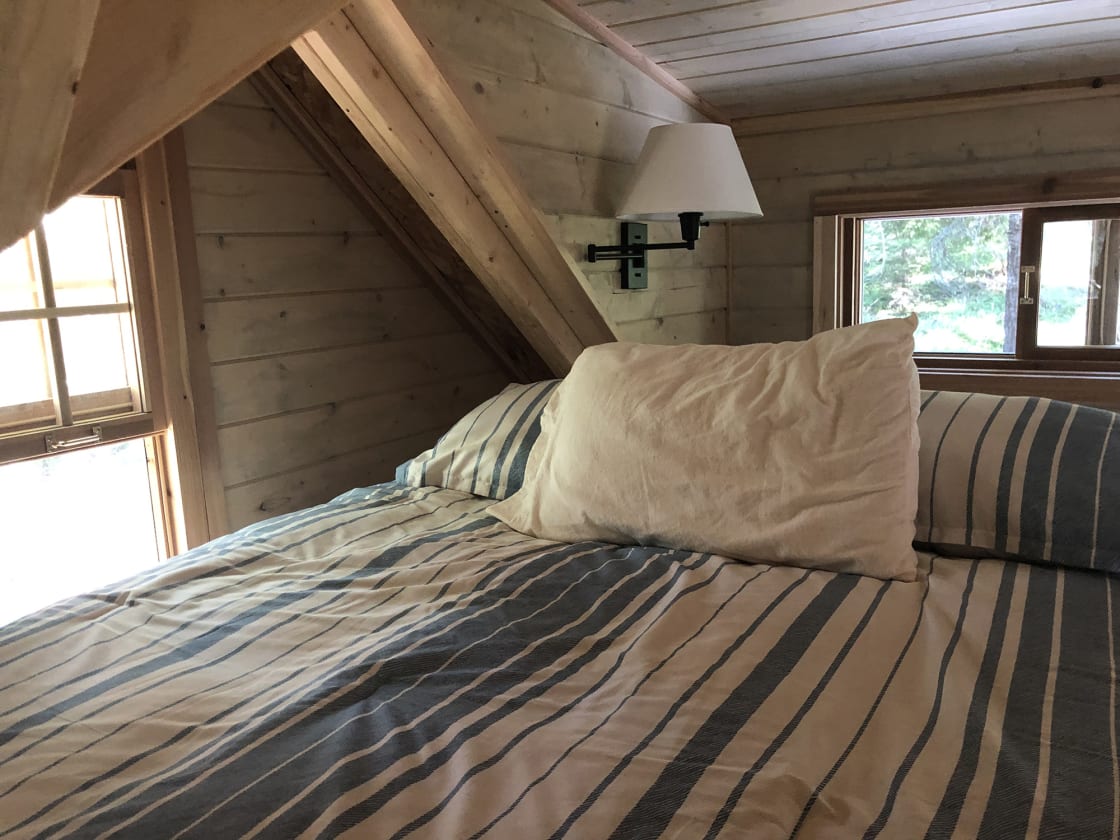 The upstairs sleeping loft offers a very comfortable bed for two.