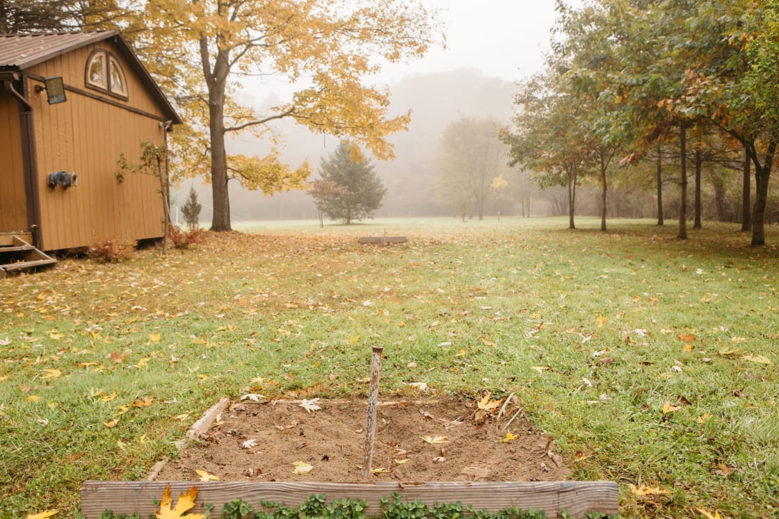 The horseshoe pit on the main lawn of the property, horseshoes included. 