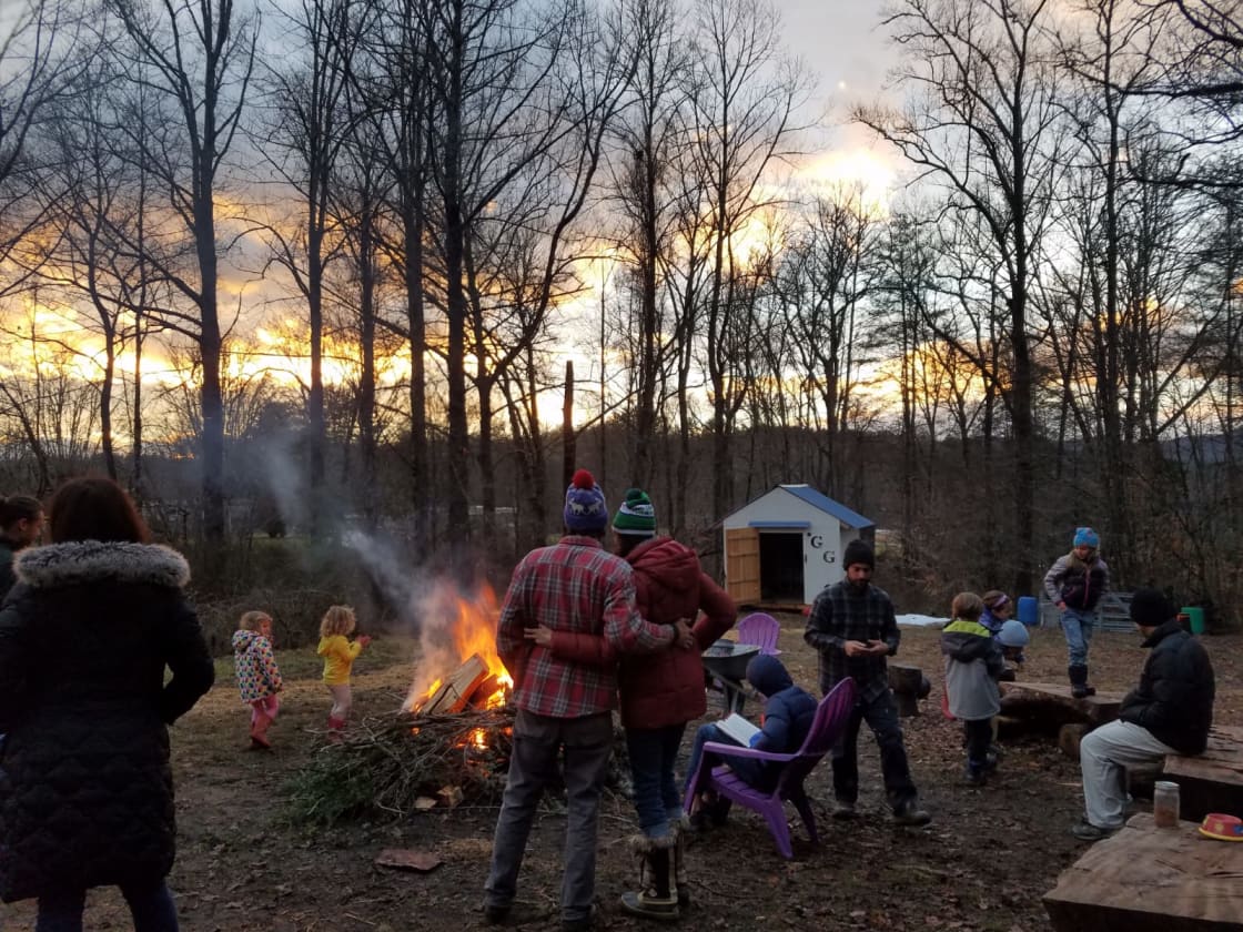 Hipcampers enjoying a fire at sunset