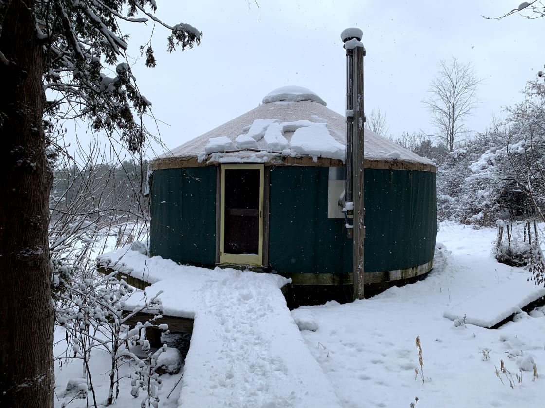 The yurt is insulated and heated by a wood stove so it stays cozy in the colder months.