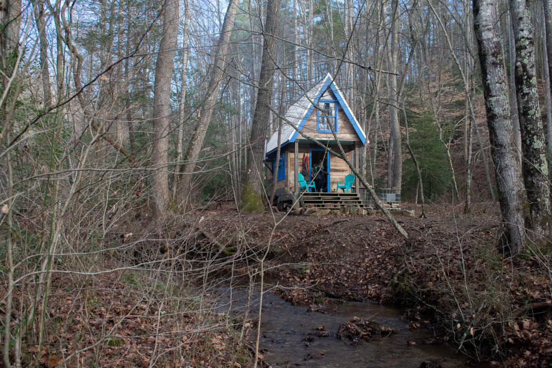 The tiny house sits right along the creek, and creates the most peaceful sound of flowing water.