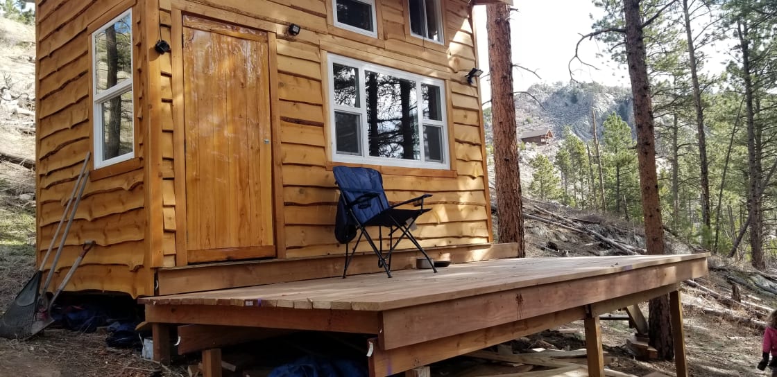 Cabin and outside deck area for lounging and enjoying coffee.