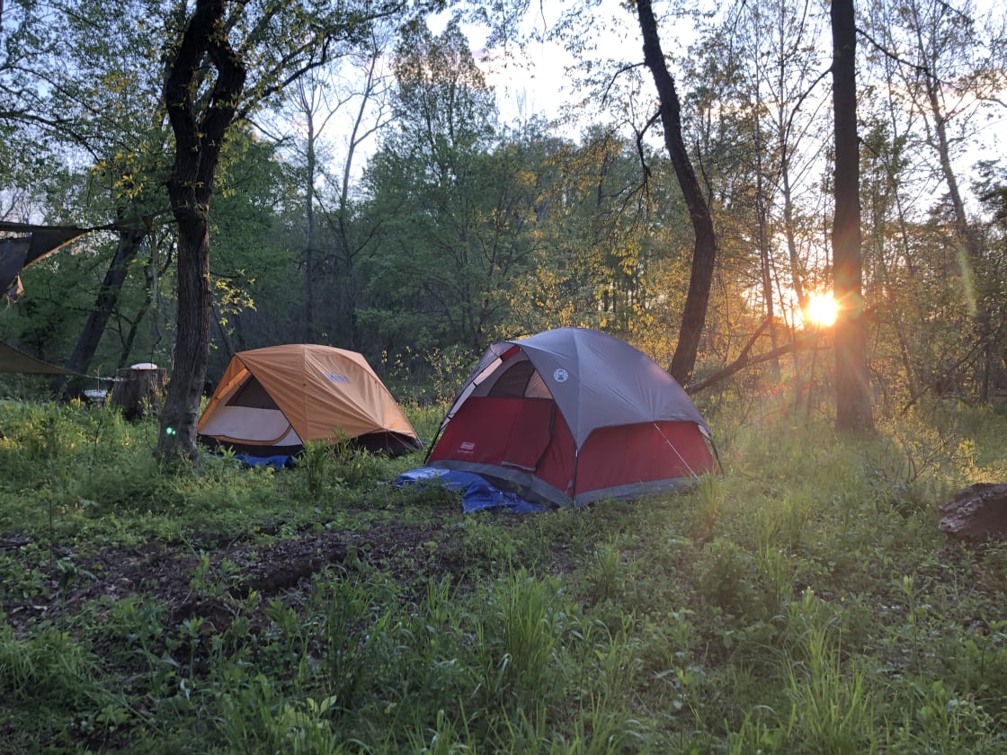 Sunset Next to the Creek.   Your tents pitched.  Have a wonderful peaceful sleep with the sounds of the creek running softly in the background all night long.  Best night sleep ever