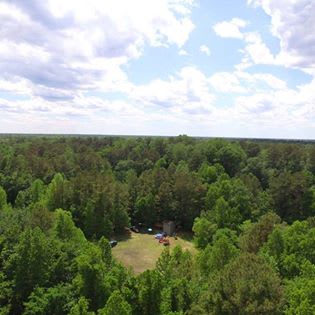 This is an aerial shot of the 6 acres lot and its centered open space!