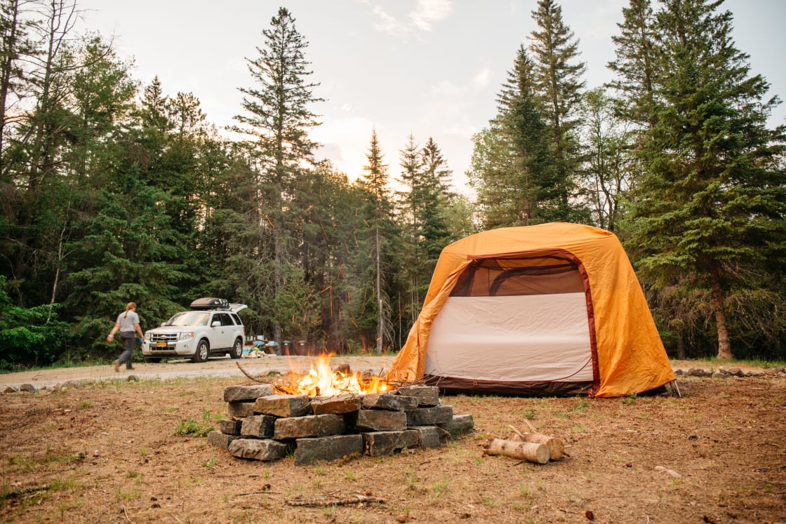 Large tent area with  a fire ring right in the middle. The ground is soft and free of roots and rocks, so getting and staying comfortable is a breeze. 