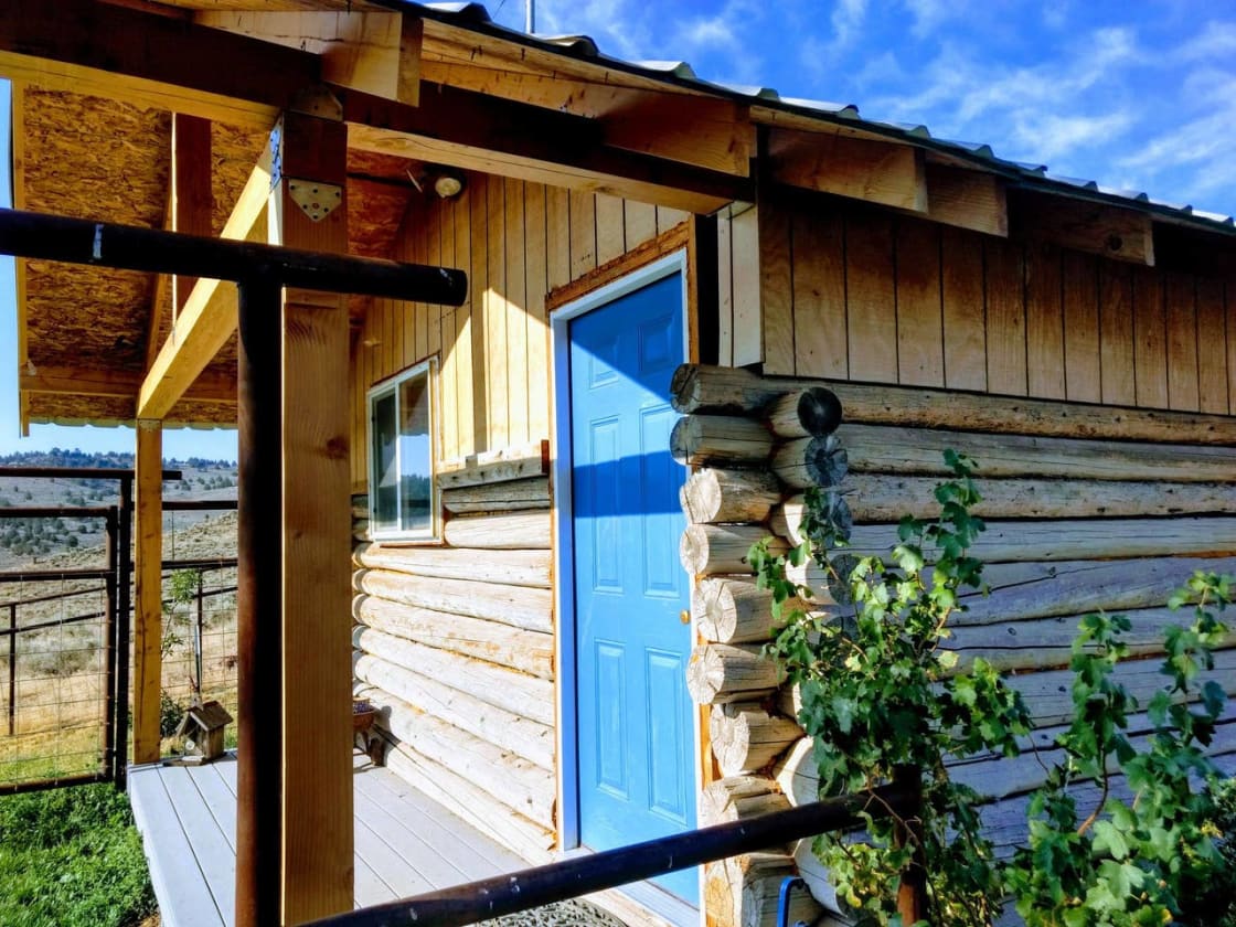 The front door and porch of your cabin.