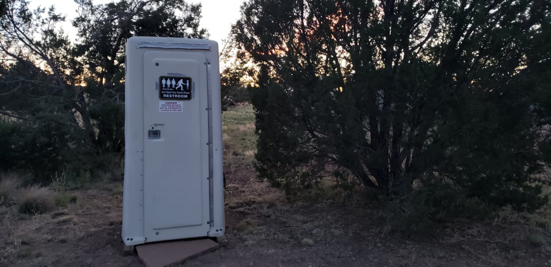 A clean Porta John toilet is ready to serve! This toilet is sanitized twice a day and as-needed. There are solar lights inside for night time use and it also contains hand sanitizer as well as our Guest Book for you to share your Spark experience! 