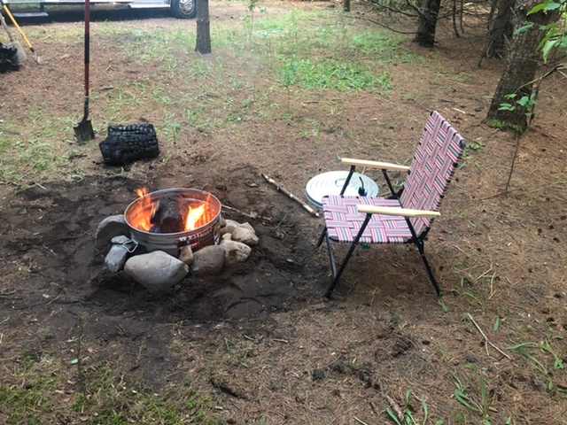 New fire pit with cover containing hot embers. 