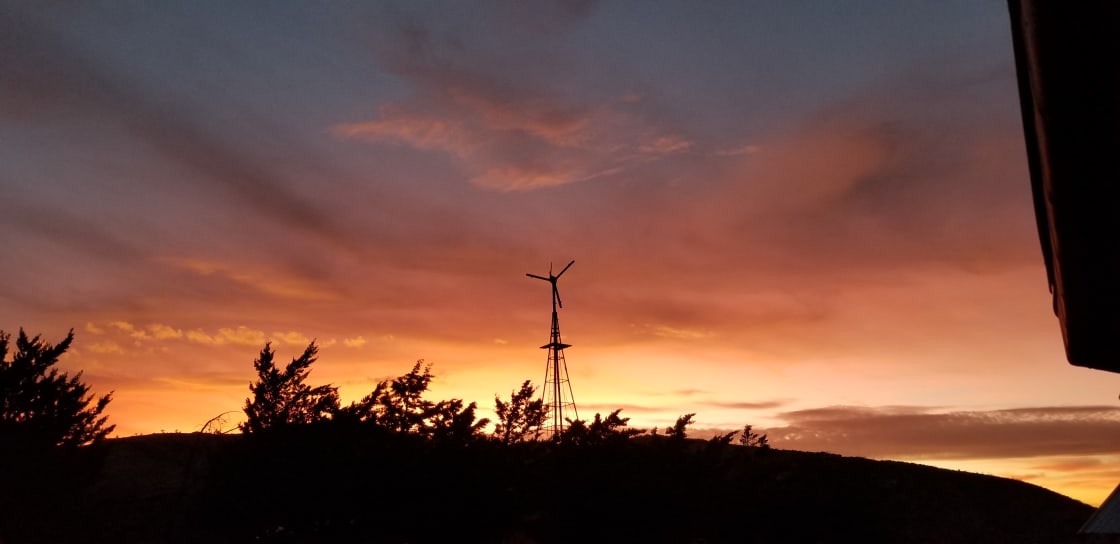 Sunset showing windmill at a Unique Mountain Retreat 
