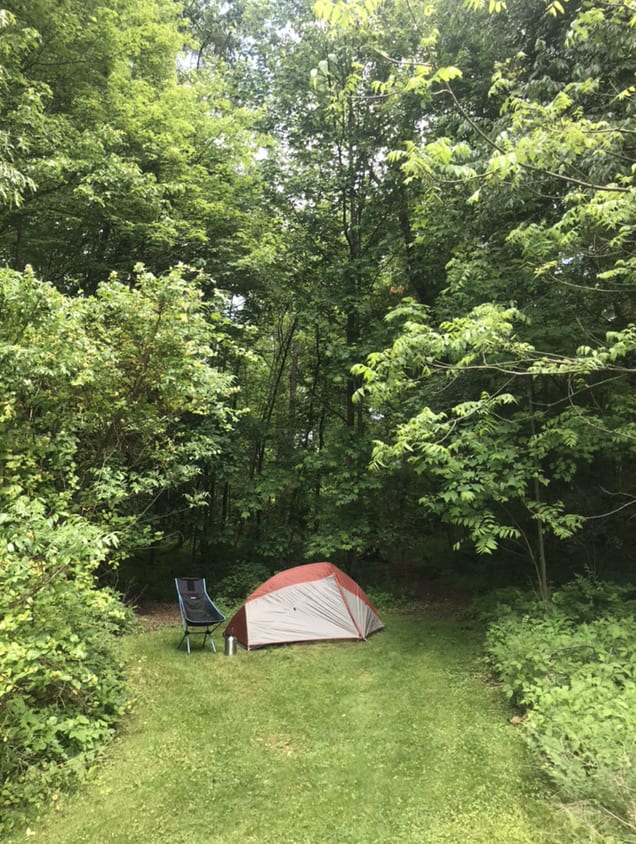 Camp spot in very bottom of yard near hiking trail. 