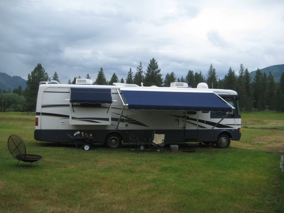 Site #1 We Welcome RV's. Pictured is a 36' Motorhome. Plenty of room to turn around. With electrical and water hookup. Lots oF privacy. Stay awhile and get comfortable by resting and relaxing in its surroundings. 