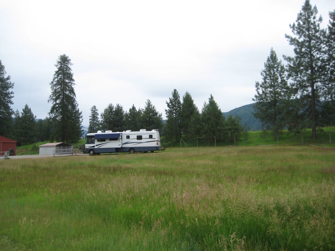 Site #1 36" Motorhome surround with a panoramic view of the mountains, with green fields, blue skies and big fluffy white clouds. Enjoy the nights by the campfire under the canopy of stars. 