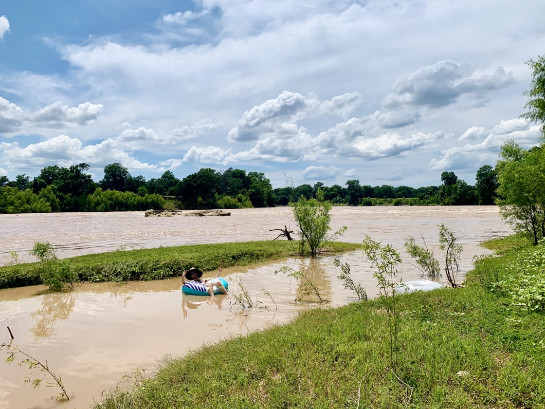 Due to recent storms, the river was high and flowing very quickly during our visit. We were able to safely float in a slow-moving area off to the side. Patti told us that the river level is usually lower and safe to swim in.