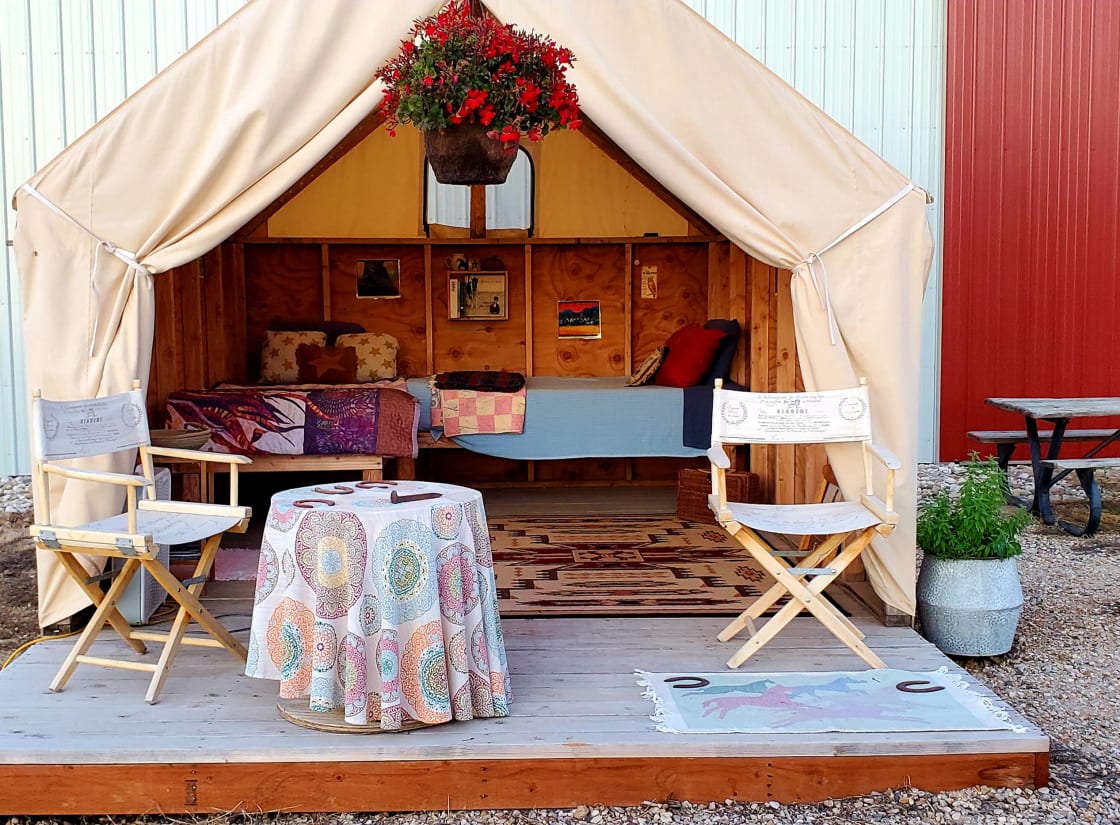 Two comfy twin beds with mattresses and linens along with access to electricity and WiFi make an evening in our Sweet Pepper Ranch Glamping Tent relaxing and convenient. 