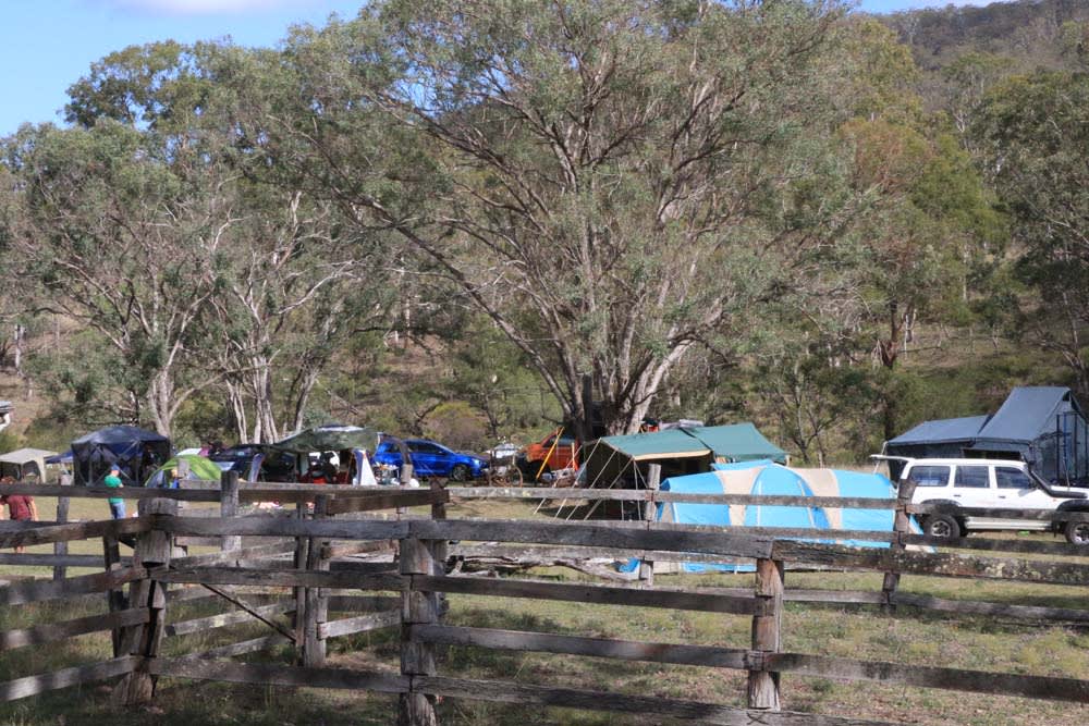 Group camping in the Dairy Paddock with old dairy yards in foreground