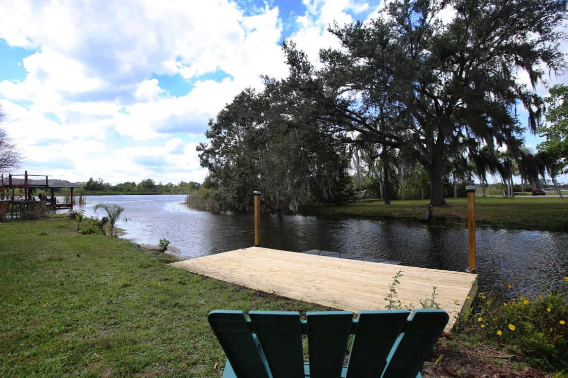 Private dock on a secluded canal is perfect for launching kayak or canoe (included with property), or motorized boat