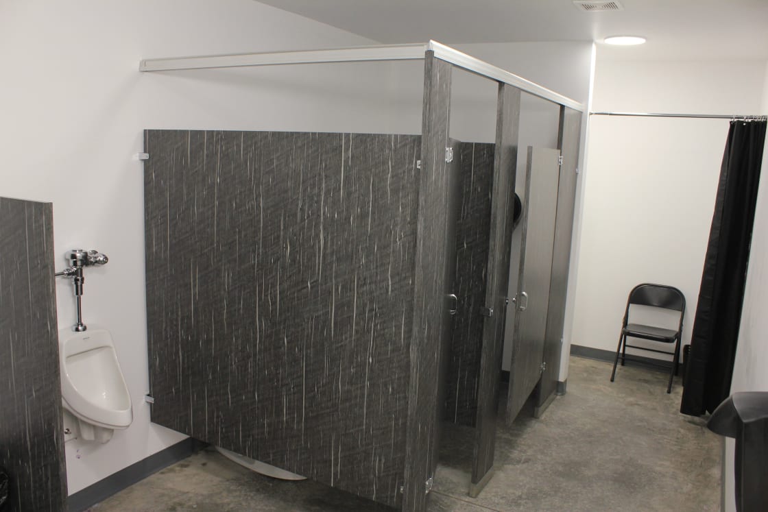 Men's and Women's bathrooms each with one shower stall inside our Event Center